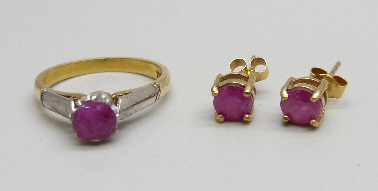 An 18ct gold and platinum set ruby ring and a pair of 9ct gold and ruby earrings, ring 2.8g, J, (