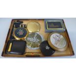 A collection of vintage compacts, a needlepoint compact lipstick, Stratton comb, large clover