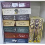 Seven George R. R. Martin books and a Complete Lewis Carroll three book set in slip case