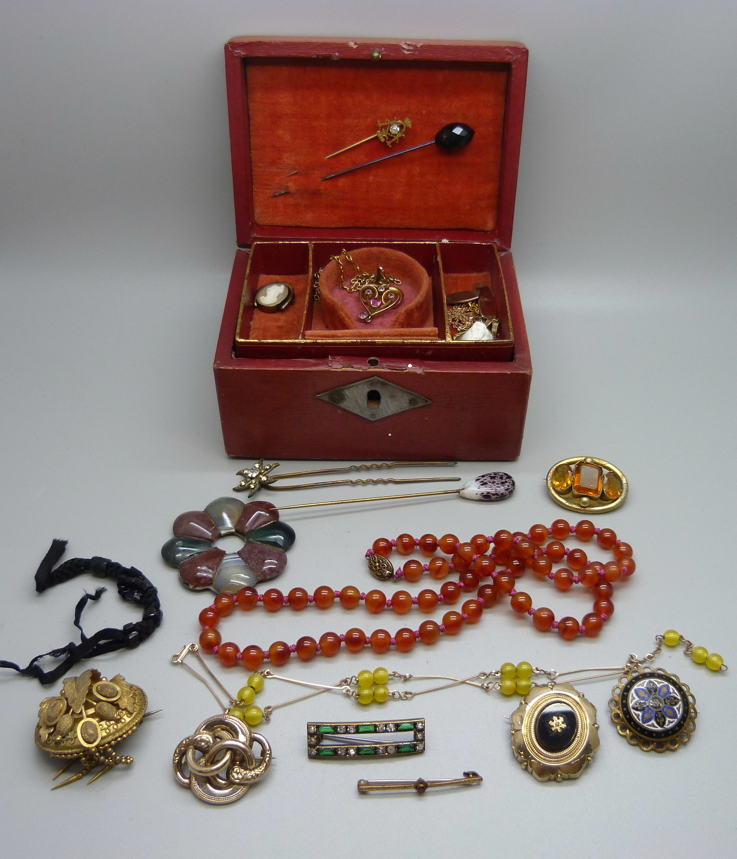 A jewellery box containing Victorian/Edwardian items, mainly jewellery; an Art Nouveau pendant, a