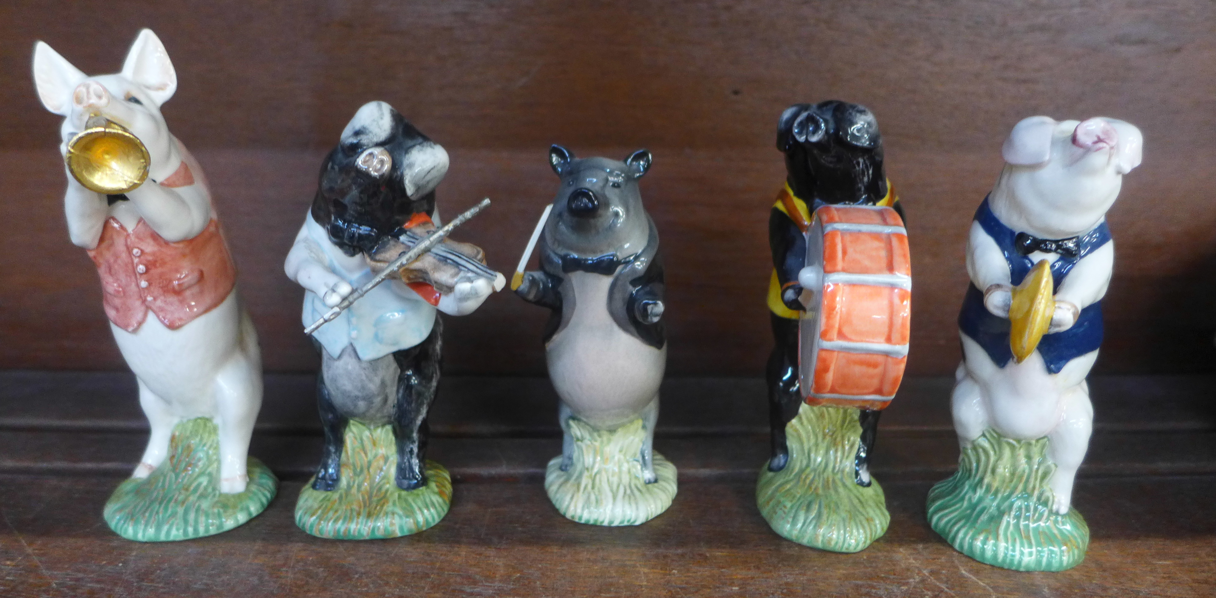 Five Beswick pig band figures, two repaired