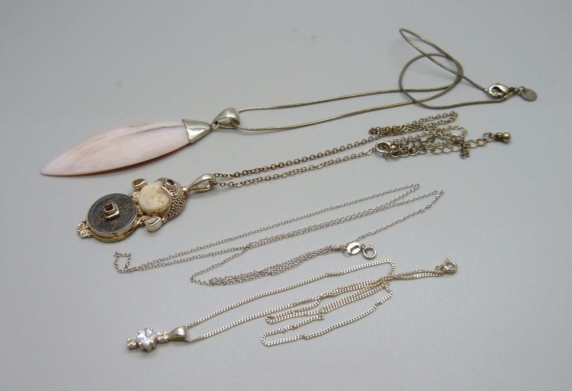 925 silver set jewellery; a pink stone pendant and chain, a small stone set pendant on chain, a