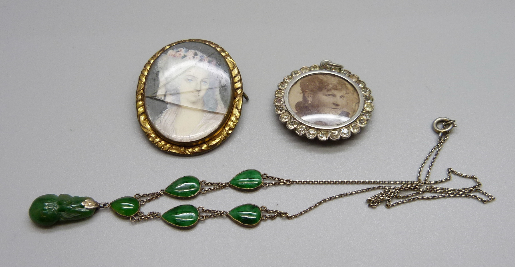 A jade set necklace, a picture pendant and a brooch lacking pin, a/f