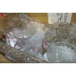 A crystal glass tray, glass comport, a pair of glass candlesticks and other mixed crystal and glass,