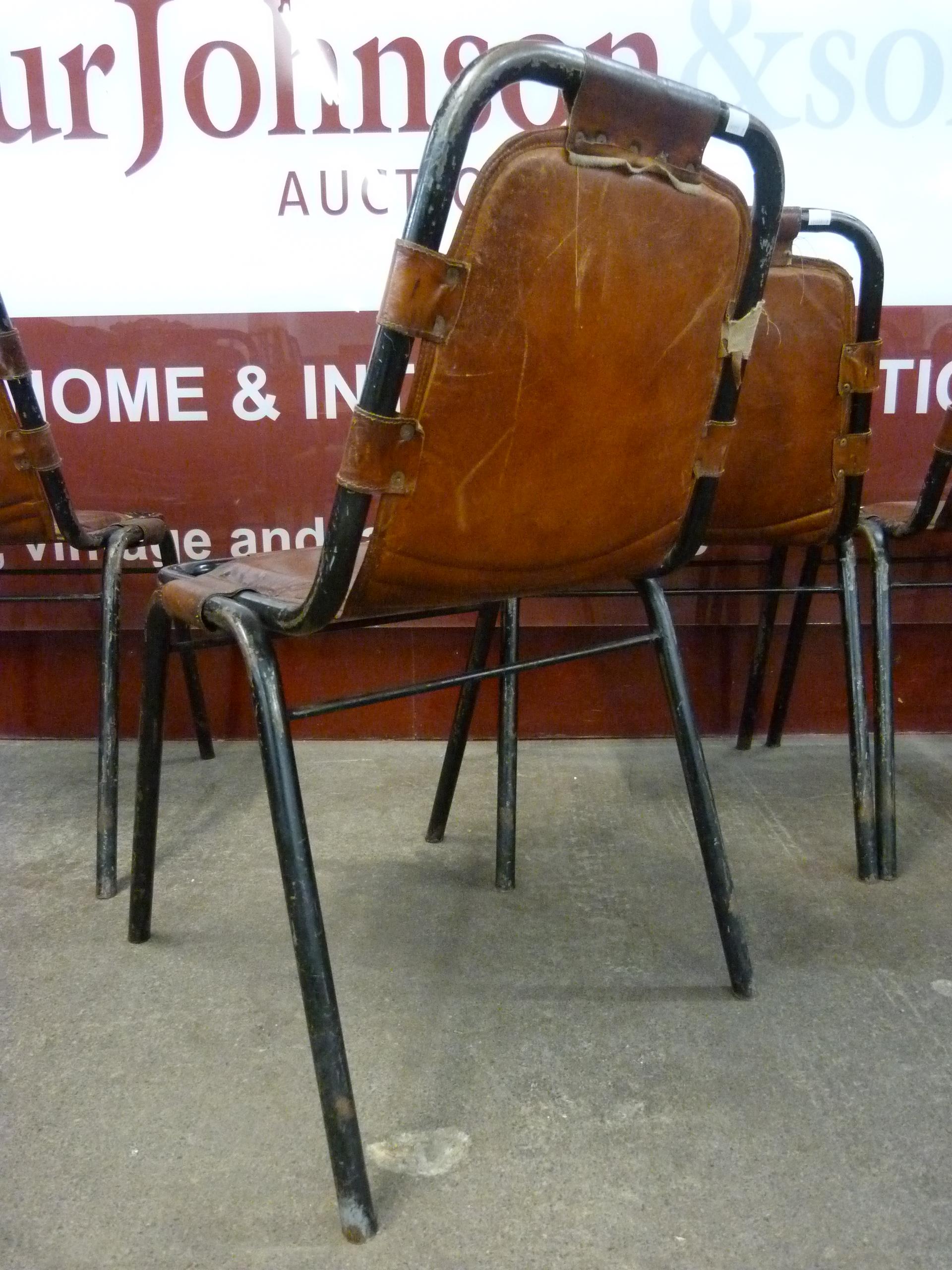 A set of four Les Arcs style black metal and brown leather chairs, attributed to Charlotte Perriand - Image 3 of 4