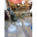 A set of three industrial ceiling lights