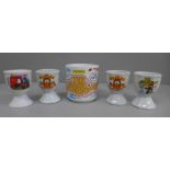 Collectors egg cups, Garfield, Postman Pat, The Magic Roundabout and a mug