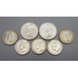 Seven coins; two 1944 2 shillings and five one shilling coins dated 1939, 1941, 1943, 1944 and 1945