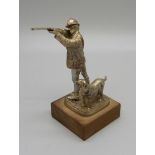 A silver model of hunter and retriever on a wooden base, 7.5cm, Birmingham 1978