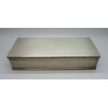 An engine turned silver cigarette box with wooden lining, 23.5 x 9.5 x 5cm, 870g gross weight