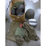 A collection of militaria; helmets, liners, boots, belts etc. **PLEASE NOTE THIS LOT IS NOT ELIGIBLE