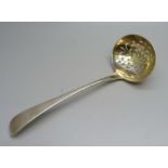 A silver sifter ladle, London 1829 with silver gilt bowl, 51g
