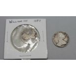 A William III sixpence and a Queen Anne sixpence