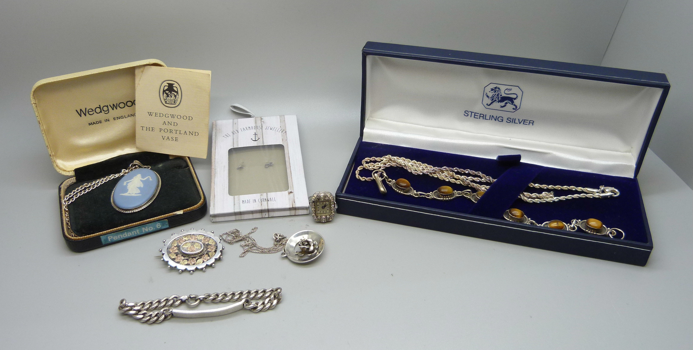 Silver jewellery including an Art Deco watch ring, a tigers eye bracelet, a white metal brooch, etc.