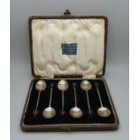 A cased set of six silver coffee bean spoons, 35g