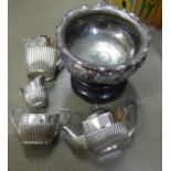 A Walker & Hall silver plated bowl and ebony stand and a four piece silver plated tea service **