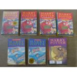 Seven Harry Potter paperback books, first editions