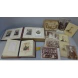 Two carte de visite albums and cabinet cards