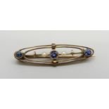 A 9ct gold brooch set with seed pearls and blue stones, 1.9g