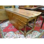 A George III style yew wood gateleg wake table