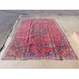 A Persian red ground Kashan rug, 311 x 224cms, a/f