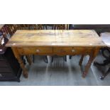 A pine two drawer kitchen table