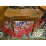 A Regency inlaid mahogany serpentine fold-over tea table