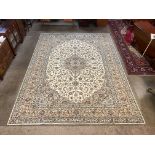 A Persian cream ground Kashan rug, 401 x 302cms