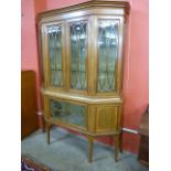 An Edward VII mahogany and satinwood inlaid breakfront display cabinet