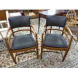 A pair of oak Art Deco Heals style oak desk chairs