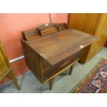 A Jentique teak metamorphic chest/desk