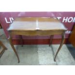 A Hepplewhite style mahogany serpentine silver table