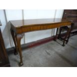 A Regency style mahogany serpentine serving table