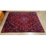 An eastern red ground rug, 325 x 240cms