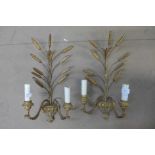 A pair of gilt metal wall lights