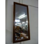 A teak framed mirror