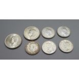 Seven coins, 2 x 1944 two shillings and 5 shillings, 1941, 1943, 1944, 1945 and 1946