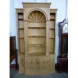 A George III style carved pine architectural library bookcase, 227cms h, 140cms w, 38cms d