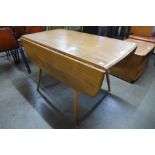 An Ercol Blonde elm and beech drop-leaf table