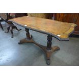 A Regency rosewood and tan leather topped serpentine coffee table