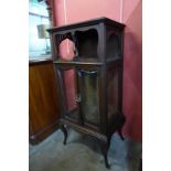 An Arts and Crafts mahogany side cabinet