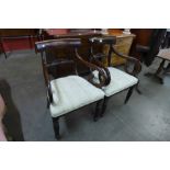 A pair of George IV mahogany elbow chairs