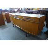 A teak bow front sideboard