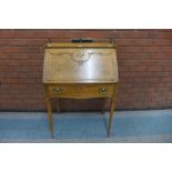 An early 20th Century French walnut, maple and brass mounted bureau de dame