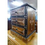 An Anglo-Indian hardwood and mother of pearl inlaid table three drawer cabinet