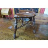 A Victorian style elm saddle seat stool