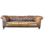 A Victorian tan leather Chesterfield settee, 63cms h, 182cms w, 91cms d