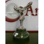 A large chrome Spirit of Ecstasy figure, on green marble socle