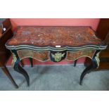 A 19th Century French red Boulle, ebonised and gilt mounted fold over serpentine games table
