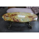 An Italian brass and onyx topped coffee table
